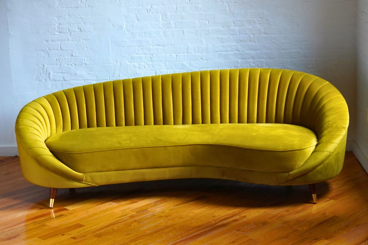Yellow curved mid-century modern sofa
