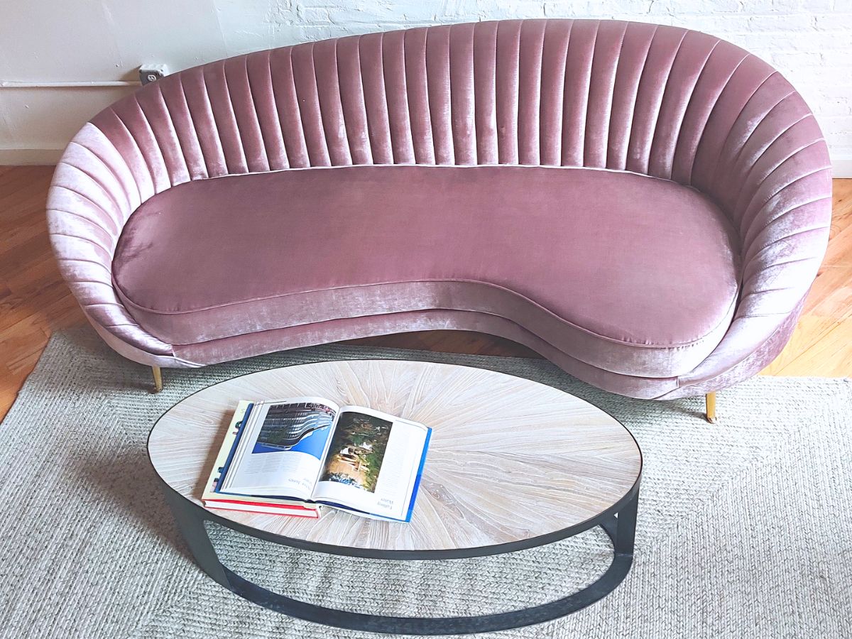 coffee table round wood w curved mid-century modern pink sofa