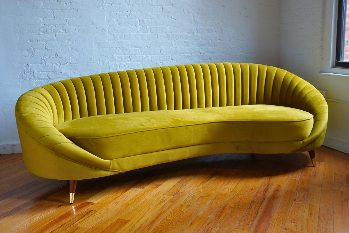 Mustard yellow curved modern sofa