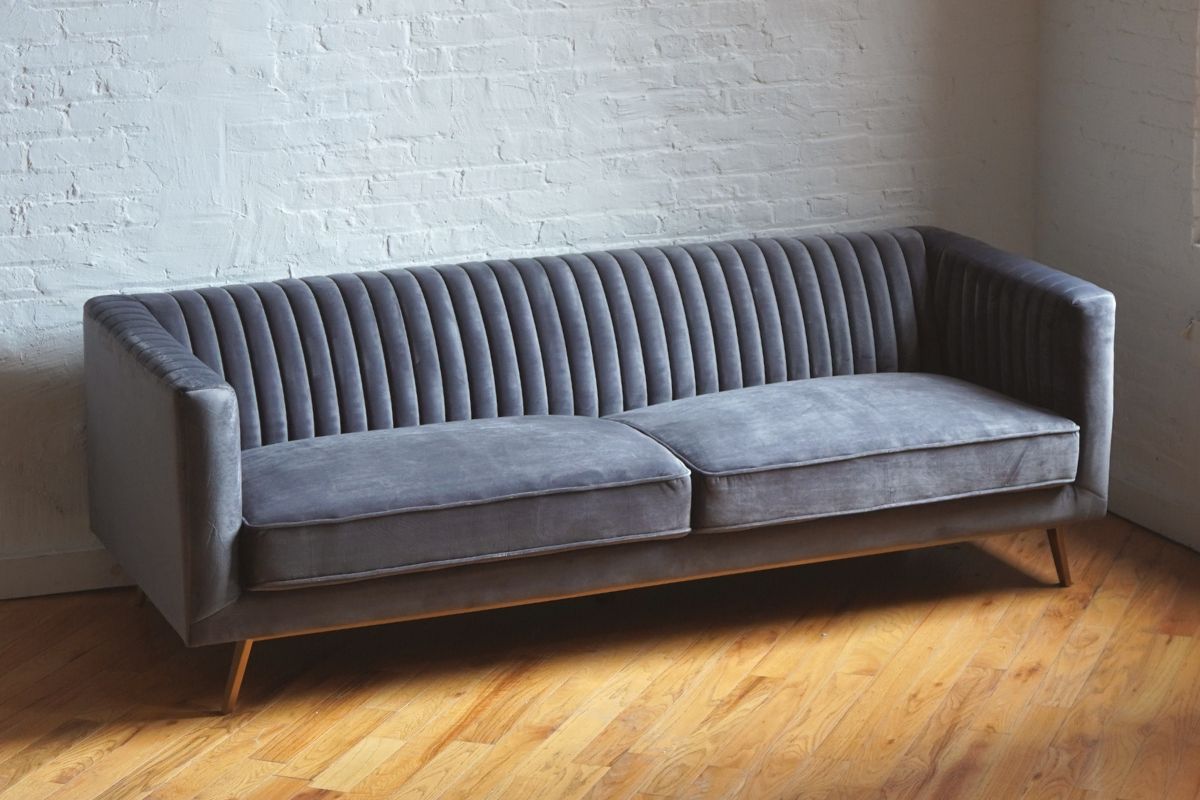 stately mid-century modern sofa in dark grey velvet