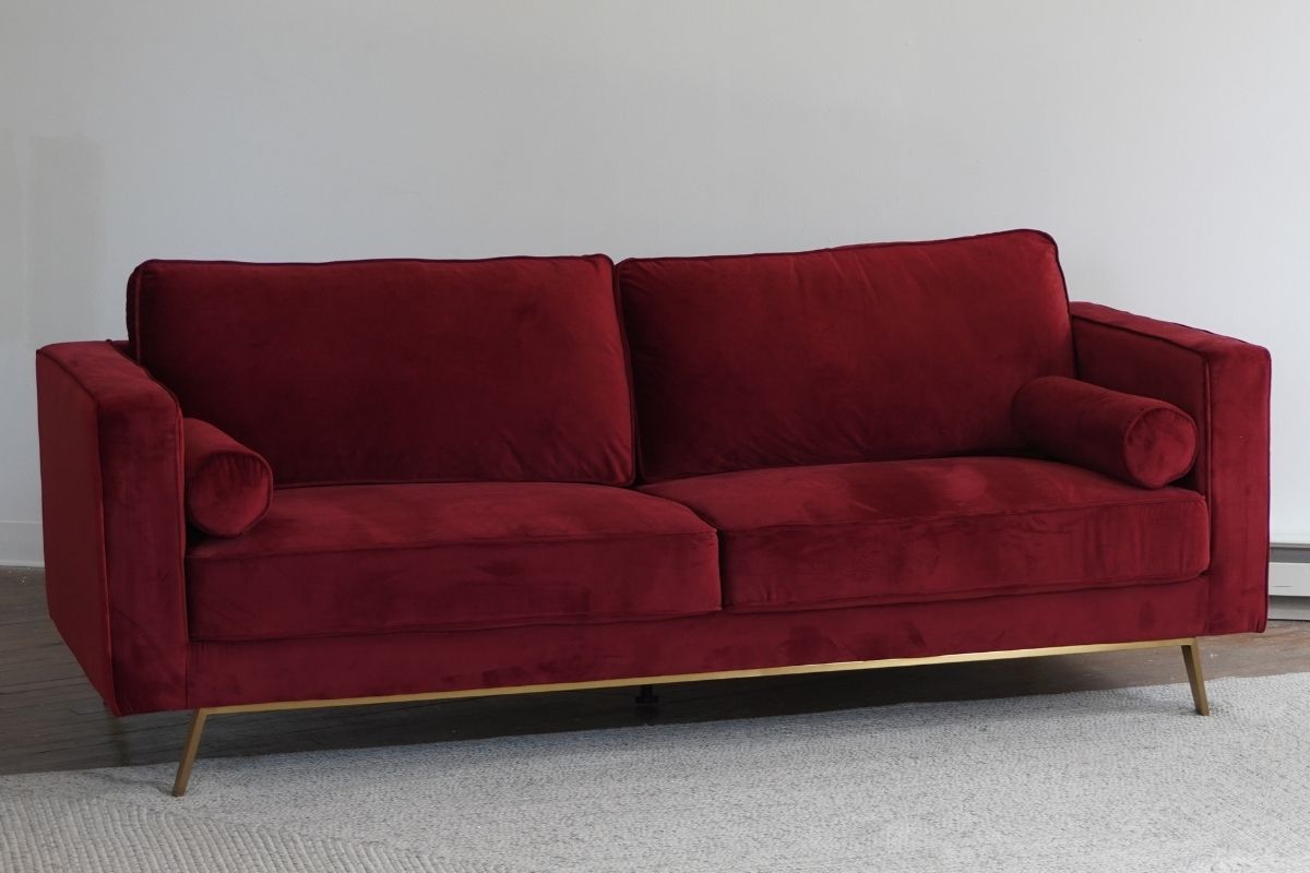 Red mid-century modern sofa with gold legs