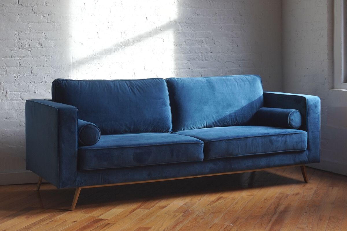 Royal blue velvet couch for mid-century modern living room