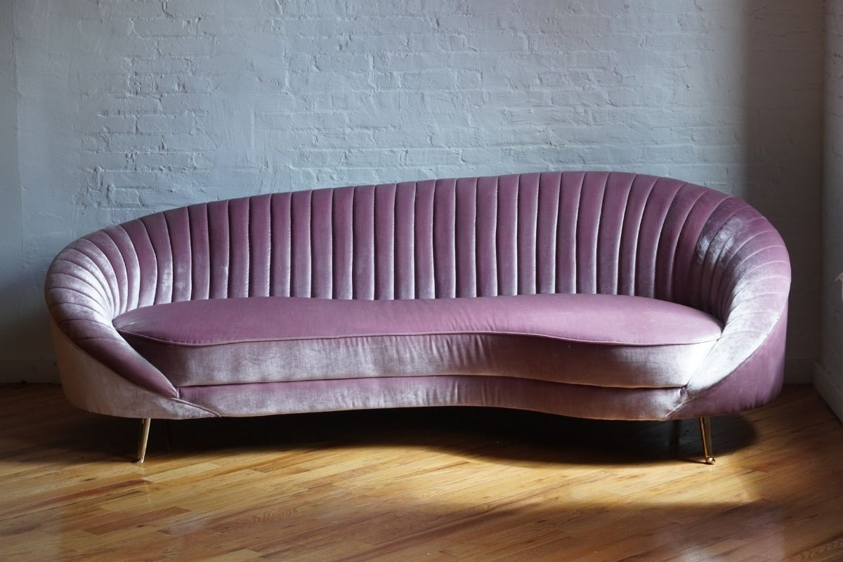 Pink curved mid-century modern sofa