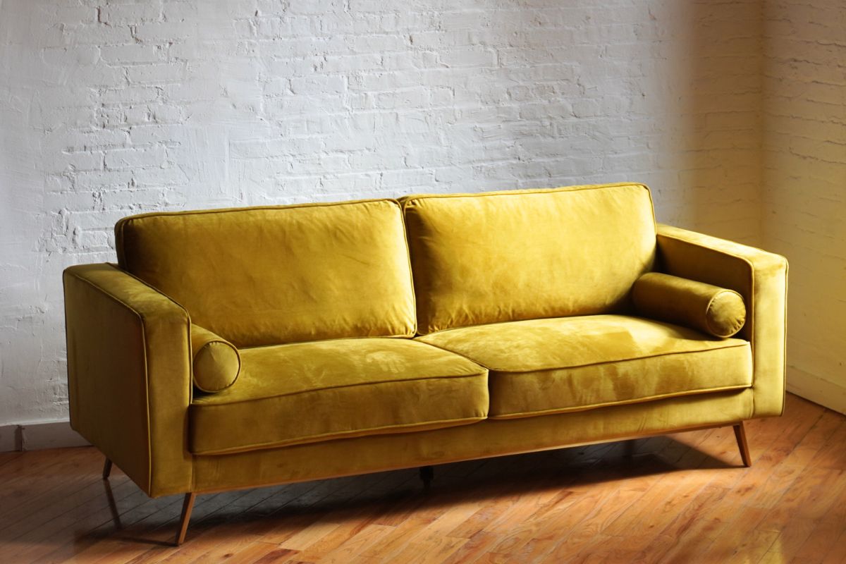 comfortable midcentury modern sofa in retro gold mauve velvet