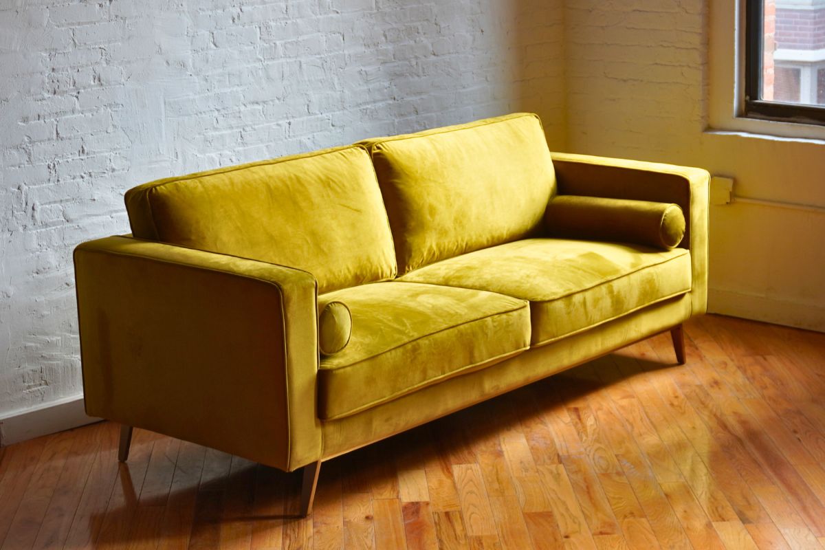 traditional midcentury modern sofa in retro yellow velvet