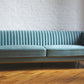 Stately seamfoam teal velvet ribbed couch with gold legs, product image front view