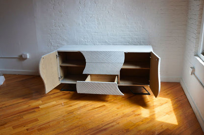 White credenza with doors that open