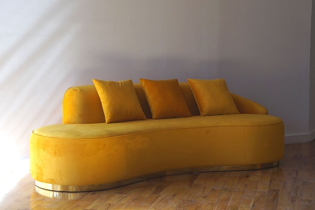 Infinity marigold sofa with gold base angled view, orange velvet sofa with three pillows product image 