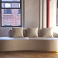 Infinity white sofa with gold base forward view, ivory white velvet sofa with three pillows product image 