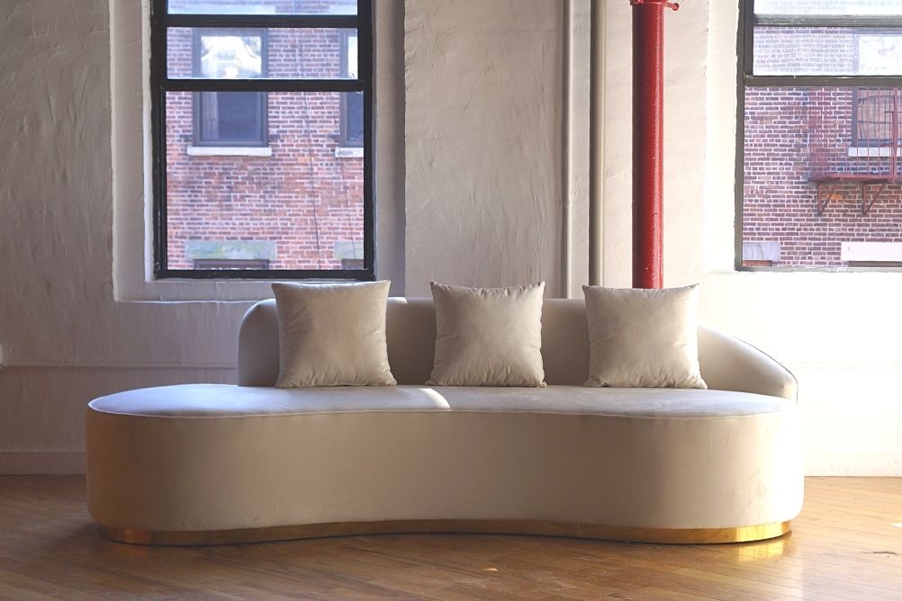 Infinity white sofa with gold base forward view, ivory white velvet sofa with three pillows product image 