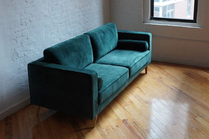 Green velvet mid-century modern couch