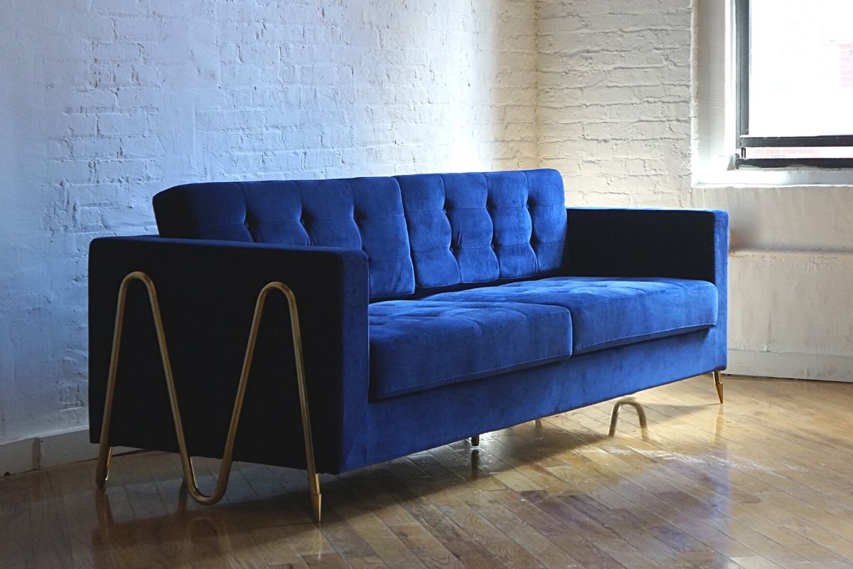 Invention royal blue couch with zig zag patterned gold feet side view, biscuit tufted couch, modern couch, mid-century modern couch product image