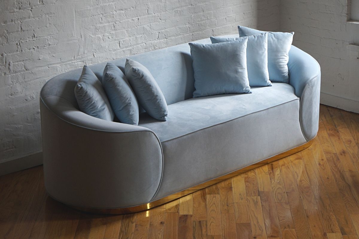 Simplicity light blue velvet couch with gold base angled view product image