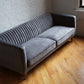 stately mic-century modern sofa in dark grey velvet