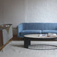 Stately light blue velvet couch with ellipse coffee table and metropolis sideboard, modern couch, mid-century modern couch staged image