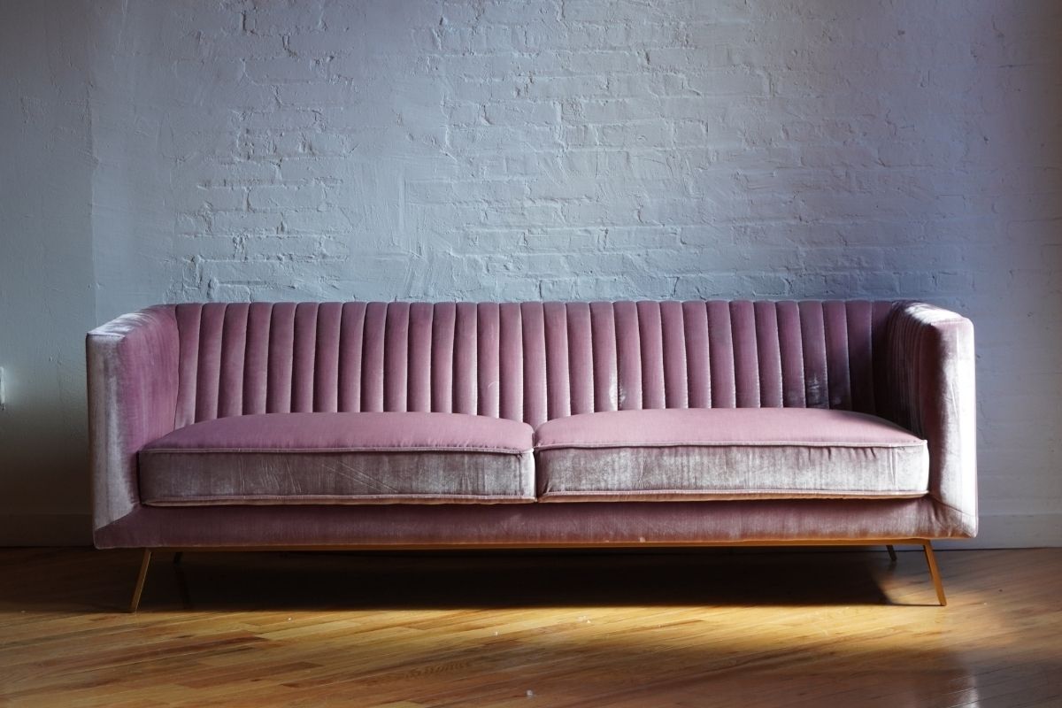 Stately rosé pink velvet couch with gold legs front view product image, Stately sofa with ribbing design