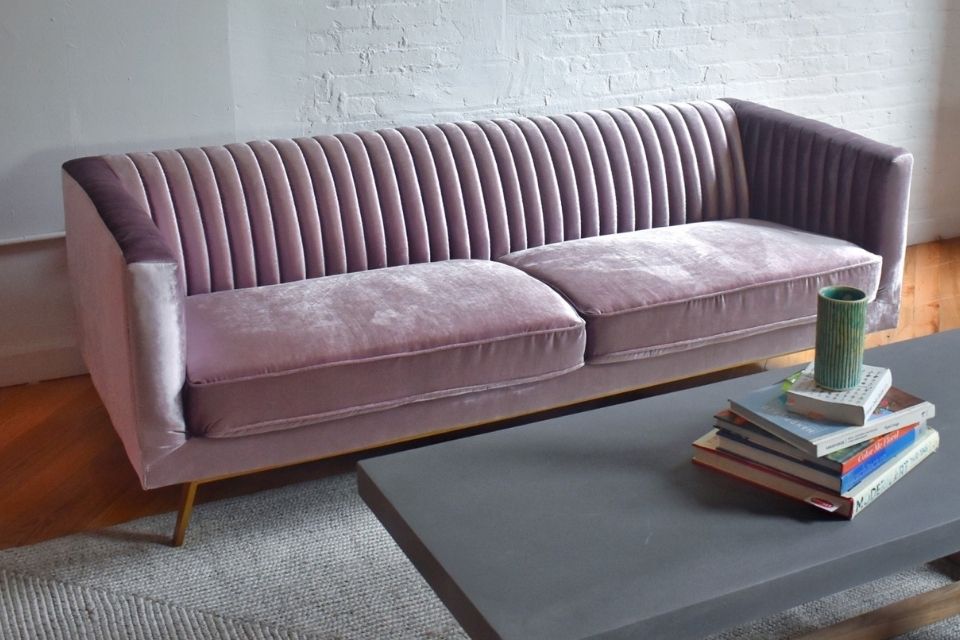 Stately pink velvet couch with beam coffee table, modern couch, mid-century modern couch, iridescent velvet couch staged image