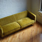 stately sofa in golden olive velvet