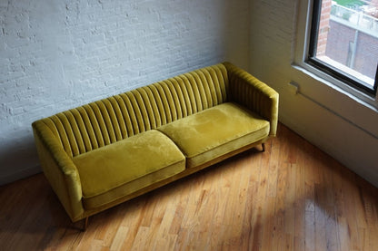 Modern sofa in vintage mustard yellow velvet