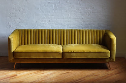 stately sofa in golden olive velvet