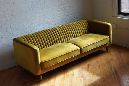 stately sofa in golden olive velvet