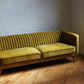 stately sofa in golden olive velvet